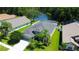 Overhead view of landscaped property with lake view at 14427 Pepperpine Dr, Tampa, FL 33626