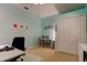 Cozy bedroom with a large closet, desk, and neutral carpet floors at 14427 Pepperpine Dr, Tampa, FL 33626