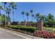 Community entrance sign amid lush tropical landscaping, showcasing the beautiful Westwood Lakes neighborhood at 14427 Pepperpine Dr, Tampa, FL 33626