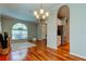 Spacious dining area with hardwood floors and arched doorway at 14427 Pepperpine Dr, Tampa, FL 33626