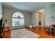 Home foyer with wood floors and an arched window at 14427 Pepperpine Dr, Tampa, FL 33626