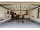 Spacious, clean garage with ample storage, organized tools, and a well-lit interior at 14427 Pepperpine Dr, Tampa, FL 33626
