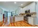 Modern kitchen featuring stainless steel appliances, granite countertops, and hardwood floors at 14427 Pepperpine Dr, Tampa, FL 33626