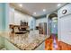 Granite countertops with stainless steel appliances in this open-concept kitchen at 14427 Pepperpine Dr, Tampa, FL 33626