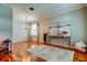 Bright living room with hardwood floors, decorative rug, and modern decor at 14427 Pepperpine Dr, Tampa, FL 33626