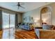 Comfortable living room with a view of the pool, complete with plush seating and stylish decor at 14427 Pepperpine Dr, Tampa, FL 33626