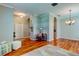 Inviting open-concept living area with wood flooring and arched doorways at 14427 Pepperpine Dr, Tampa, FL 33626