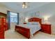 Comfortable main bedroom featuring a ceiling fan and stylish decor at 14427 Pepperpine Dr, Tampa, FL 33626