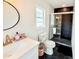 Beautiful bathroom featuring tiled walk-in shower, sleek vanity, and modern fixtures at 1972 Briarwood St, Dunedin, FL 34698