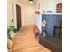 Inviting entryway with a fireplace, wooden bench and view of the front door at 1972 Briarwood St, Dunedin, FL 34698