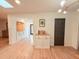 Open-concept living area with modern decor and easy access to the kitchen at 1972 Briarwood St, Dunedin, FL 34698