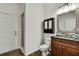 Elegant bathroom with stylish vanity, dark wood cabinets, tile backsplash, and glass door shower at 22431 Panther Run Ct, Land O Lakes, FL 34639