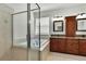 Bathroom boasting tiled floors, a soaking tub, glass shower and double vanity at 22431 Panther Run Ct, Land O Lakes, FL 34639
