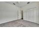 Cozy bedroom featuring carpeted floors, a closet, and an entrance to another room at 22431 Panther Run Ct, Land O Lakes, FL 34639