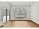 The dining room features wood-look tile flooring, a window, and a sliding door at 22431 Panther Run Ct, Land O Lakes, FL 34639