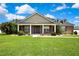 Charming single-Gathering home featuring a large front yard, well-maintained lawn and landscaping at 22431 Panther Run Ct, Land O Lakes, FL 34639