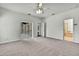 Spacious main bedroom with walk-in closet, carpet, and access to the bathroom at 22431 Panther Run Ct, Land O Lakes, FL 34639