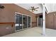 Inviting outdoor patio featuring sliding glass doors, recessed lights, mounted shelving and ceiling fan for ultimate comfort at 22431 Panther Run Ct, Land O Lakes, FL 34639