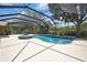 Serene screened pool and spa with mature landscaping create a private backyard retreat perfect for relaxation and entertaining at 22431 Panther Run Ct, Land O Lakes, FL 34639