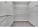 Walk-in closet featuring shelving for storage of clothes, shoes, and accessories at 22431 Panther Run Ct, Land O Lakes, FL 34639