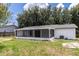 The backyard features an ample lawn and a lovely screened-in patio, great for relaxation and entertaining at 22716 Penny Loop, Land O Lakes, FL 34639