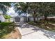 Exterior of home with gray garage door, concrete driveway, and well-maintained landscaping for excellent curb appeal at 22716 Penny Loop, Land O Lakes, FL 34639