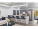 Kitchen with gray cabinets, a breakfast bar with blue chairs, and white countertops at 22716 Penny Loop, Land O Lakes, FL 34639