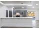 Updated kitchen with gray cabinets, white countertops, and stainless steel appliances at 22716 Penny Loop, Land O Lakes, FL 34639
