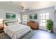 Spacious main bedroom featuring decor, ample natural light, and wood-look flooring at 22716 Penny Loop, Land O Lakes, FL 34639