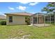 A beautiful backyard with a screened in patio offering a relaxing outdoor living space at 2544 Rosehaven Dr, Wesley Chapel, FL 33544