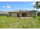 Well-maintained backyard with screened patio, offers ample space for entertaining and relaxation at 2544 Rosehaven Dr, Wesley Chapel, FL 33544