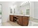 Bathroom with double vanity sinks and tile flooring with a garden tub at 2544 Rosehaven Dr, Wesley Chapel, FL 33544