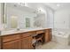 Bathroom with double vanity sinks, a soaking tub, and white tiled floors at 2544 Rosehaven Dr, Wesley Chapel, FL 33544