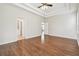 Spacious bedroom with hardwood floors and access to the Primary bath and hallway at 2544 Rosehaven Dr, Wesley Chapel, FL 33544
