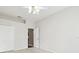 A simple, vacant bedroom with carpeted floors, a ceiling fan, and ample closet space at 2544 Rosehaven Dr, Wesley Chapel, FL 33544