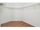 Walk-in closet features laminate wood floor and a metal shelving system for maximum storage at 2544 Rosehaven Dr, Wesley Chapel, FL 33544