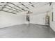 Spacious garage with painted floor offers ample parking and storage, with utilities neatly organized at 2544 Rosehaven Dr, Wesley Chapel, FL 33544