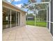The covered and screened in lanai has plenty of room for activities at 2544 Rosehaven Dr, Wesley Chapel, FL 33544