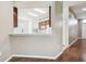 Stylish view into the kitchen featuring hardwood floors, neutral walls and view of the kitchen at 2544 Rosehaven Dr, Wesley Chapel, FL 33544
