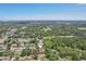 An aerial view showcasing the home's location in a verdant, tree-filled neighborhood at 2896 Grand Cayman St, Sarasota, FL 34231