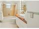 Renovated bathroom featuring unique vanity with vessel sink, modern fixtures, and a shower-tub combo at 2896 Grand Cayman St, Sarasota, FL 34231