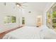 This bedroom features wood floors, a high ceiling, and a window at 2896 Grand Cayman St, Sarasota, FL 34231