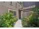 Charming home exterior with lush landscaping, a paved walkway, and a welcoming entrance at 2896 Grand Cayman St, Sarasota, FL 34231