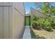 Shot of the front exterior featuring the house number and a decorative green front door with a long walkway at 2896 Grand Cayman St, Sarasota, FL 34231