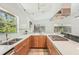 Kitchen featuring ample countertop space, wood cabinets, and views of the backyard at 2896 Grand Cayman St, Sarasota, FL 34231