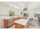 Bright and spacious kitchen featuring a large island, stainless steel appliances, and natural light at 2896 Grand Cayman St, Sarasota, FL 34231