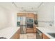 Modern kitchen featuring stainless steel appliances, light wood cabinets, and an expansive counter-top at 2896 Grand Cayman St, Sarasota, FL 34231