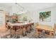 Open kitchen featuring barstool seating, stainless steel appliances, and a combined dining area at 2896 Grand Cayman St, Sarasota, FL 34231