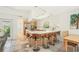 Kitchen with a breakfast bar, modern island, stainless steel appliances, and a dining table adjacent at 2896 Grand Cayman St, Sarasota, FL 34231