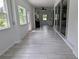 Bright kitchen with gray wood tile flooring and stainless steel appliances at 29916 Cedar Waxwing Dr, Wesley Chapel, FL 33545
